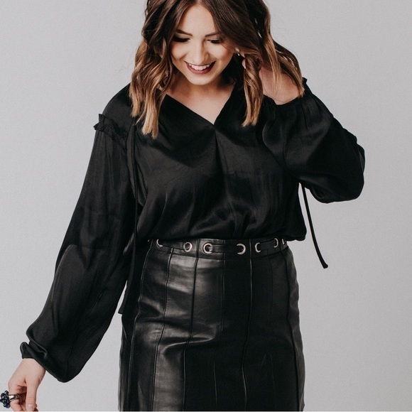 Beautiful black silky peasant blouse. Cute ruffle detail on top with neck tie. - Picture 2 of 7